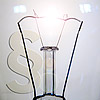 Filament lamp in front of paragraph symbol